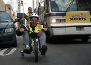 Guy Wins Race Against NYC Bus On Big Wheel