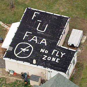 Couple Paints "FU FAA" On Roof To Protest Jet Noise