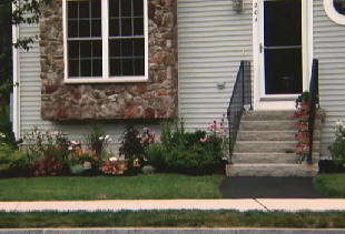 Condo Association Puts Lien On Woman's Townhouse Over Tiny Flower Garden