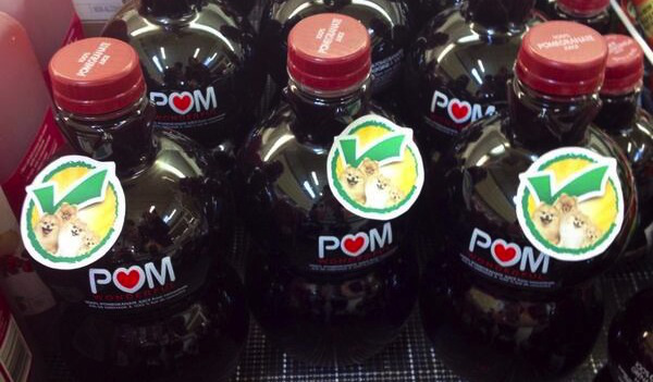 These labels saying POM contains actual pomeranians may be as accurate as its claims to curing heart disease or prostate cancer. (Photo: Twitter user @nmlehman)