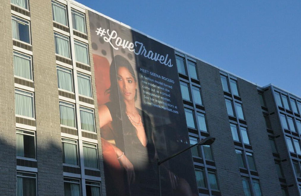 A Marriott in D.C. is wrapped with a large banner featuring model Geena Rocero. 