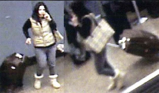 One of the suspects caught on camera allegedly stealing a bag from the Sea-Tac baggage claim.
