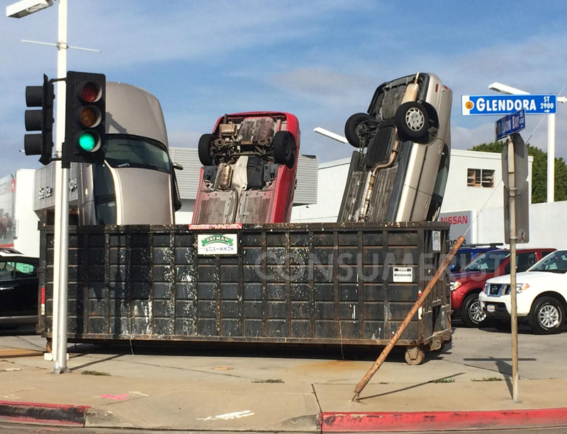 Yes, Those Are Real Cars Poking Out Of This Dumpster