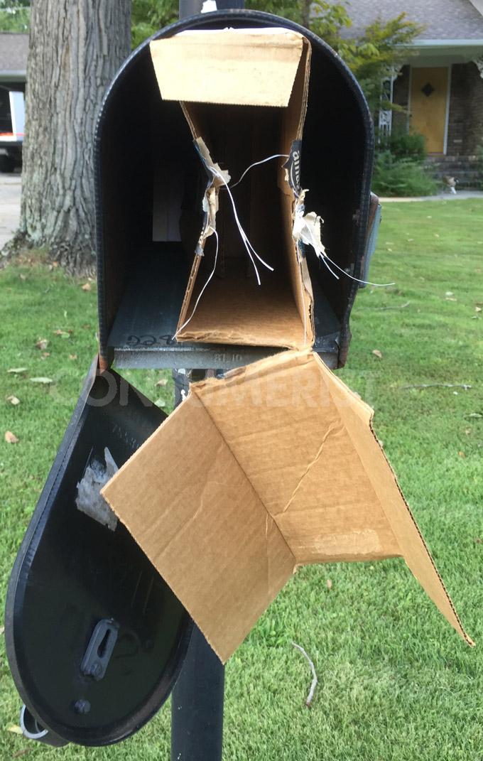 Mail Carrier Wedges Package in Box, Doesn’t Have To Leave Vehicle