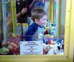 Hey, Look! There’s a kid in this claw machine!