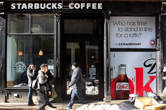 Diet Coke's Anti-Starbucks Ad Finds Perfect Home On Wall
Outside Starbucks