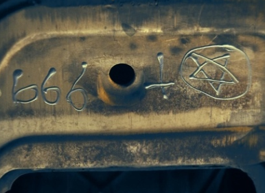 Walmart Customer Goes In For Oil Change, Drives Away With 'Satanic Symbols' On Car