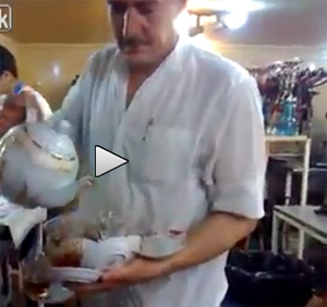 Amazing Waiter Pours Nearly A Dozen Cups Of Tea One-Handed