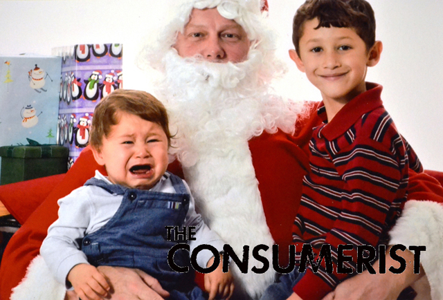 Paul writes: "The photo was taken last year at my church.  My oldest, Anthony, tried his best to contain his laughter at the sheer terror that Alex was experiencing.  Needless to say, it seems that the experience was traumatic as this year, Alex is creeped out by our Santa figures in the house."