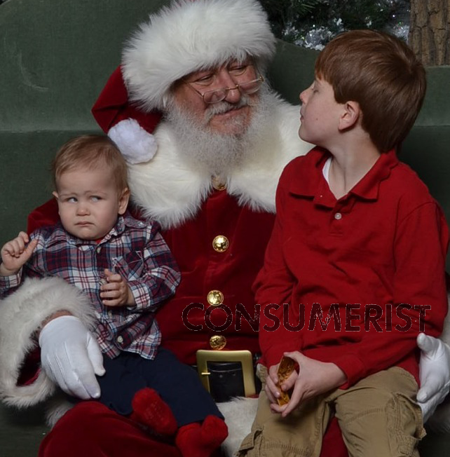 Consumer reader Jackie says her one-year-old Seth was so put off by Santa he wouldn't even make eye contact, while big brother Rylan appears to see the benefits of being nice to the big guy. 