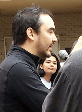 Tim Wu speaking outside the FCC in May.