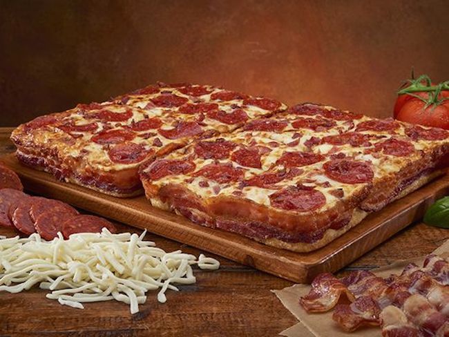 Little Caesars has wrapped a pizza in bacon. Behold.