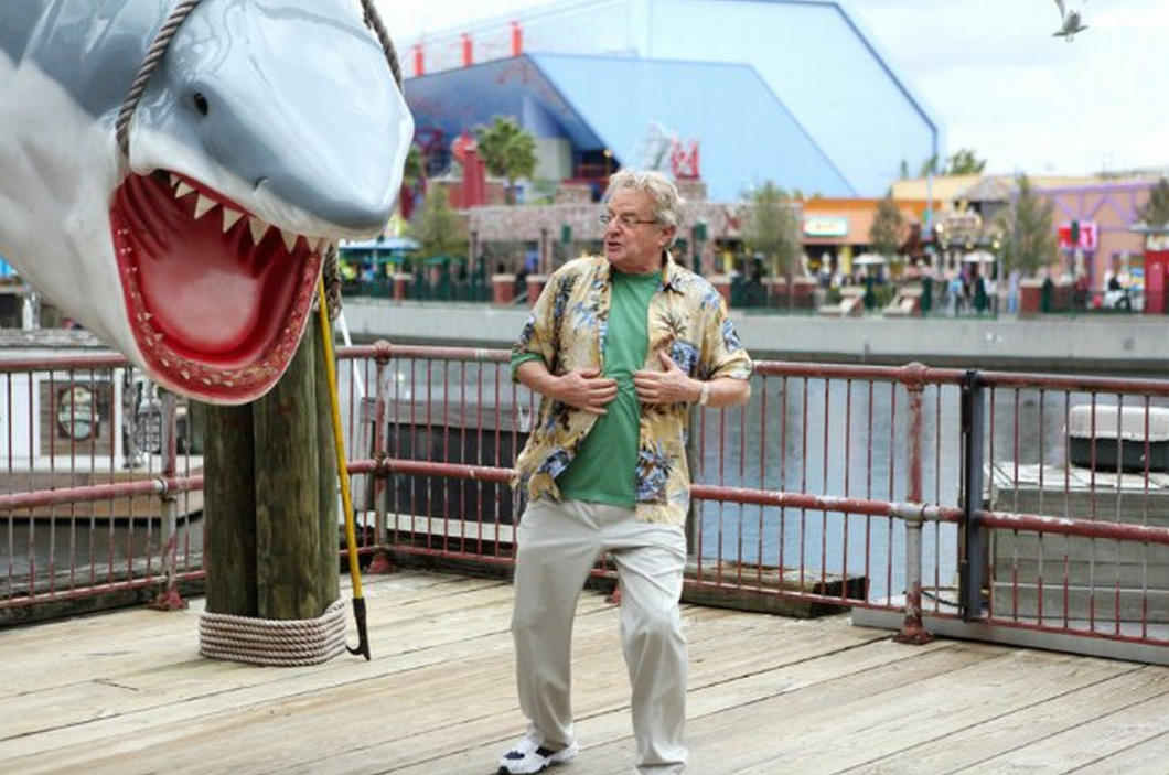 Comcast's Universal Studios park is the backdrop for Jerry Springer and other Comcast-tied celebs to cash in on what remains of the Sharknado craze.