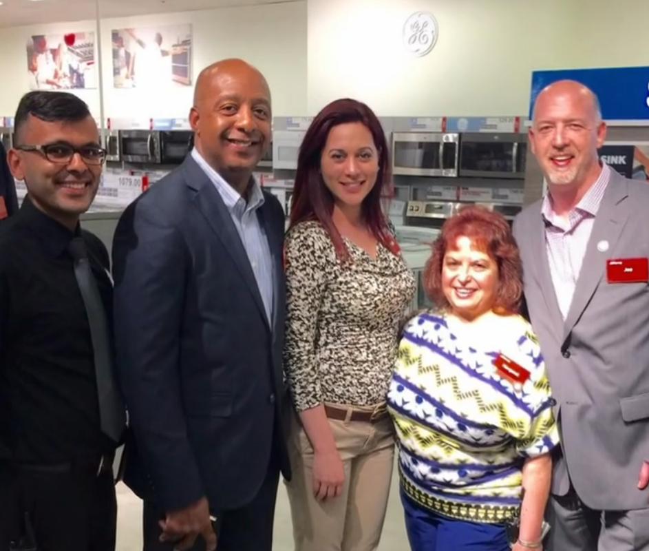 Spot the CEO: Marvin Ellison is second from left, posing with store employees.