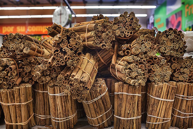 bundles of cinnamon sticks in market: photo by Jackie Alpers